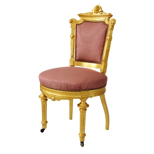 2574 - A pair of 19th century French side or salon chairs with shaped and gilded frames, upholstered seats ... 