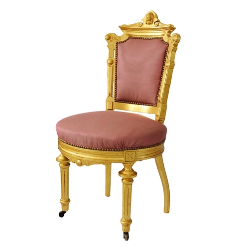 2574 - A pair of 19th century French side or salon chairs with shaped and gilded frames, upholstered seats ... 