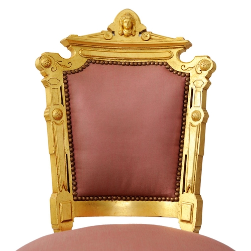 2574 - A pair of 19th century French side or salon chairs with shaped and gilded frames, upholstered seats ... 