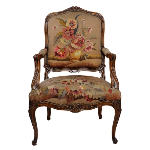 2590 - 19th century French open armchair with carved and moulded showwood frame in beech, with floral tapes... 