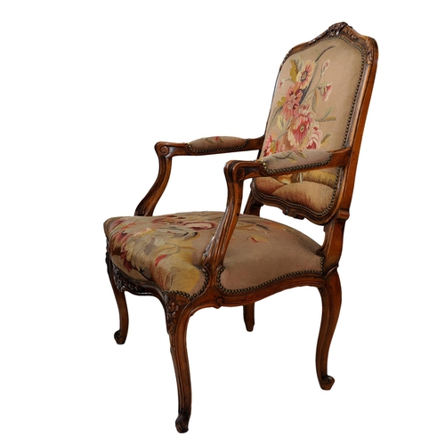 2590 - 19th century French open armchair with carved and moulded showwood frame in beech, with floral tapes... 