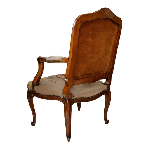 2590 - 19th century French open armchair with carved and moulded showwood frame in beech, with floral tapes... 