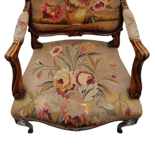 2590 - 19th century French open armchair with carved and moulded showwood frame in beech, with floral tapes... 