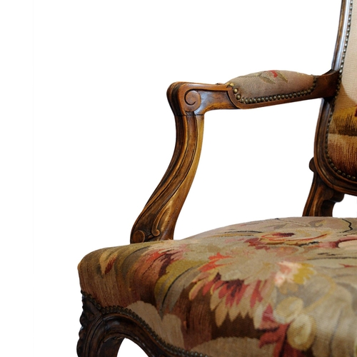 2590 - 19th century French open armchair with carved and moulded showwood frame in beech, with floral tapes... 