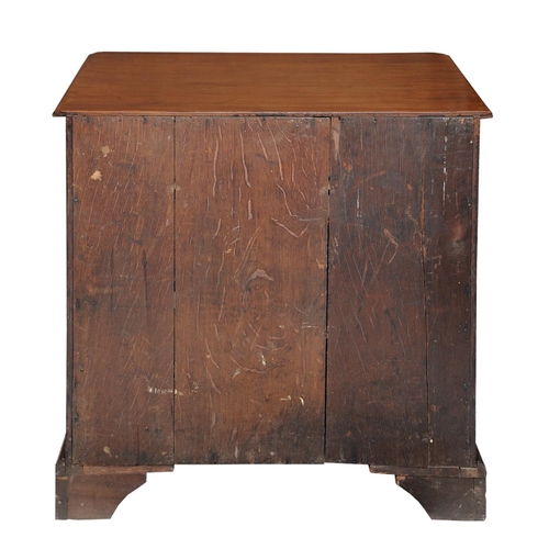 2601 - An 18th century mahogany and oak lined kneehole writing desk the central cupboard surrounded by an a... 