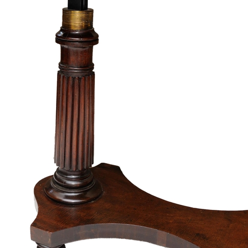 2616 - A Regency mahogany cantilever writing table with adjustable rising action, raised on a fluted column... 