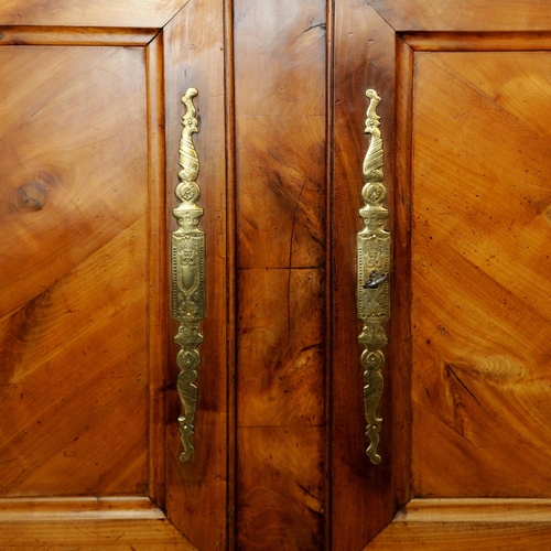 2623 - 18th century cherry wood armoire, the front enclosed by two pairs of panelled doors within a panelle... 