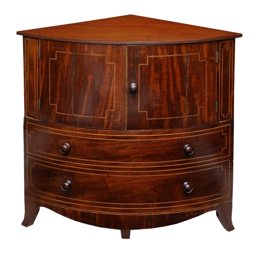 2664 - A Georgian mahogany corner commode with rising lid, with bowfronted outline, the front elevation enc... 