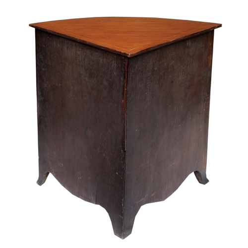 2664 - A Georgian mahogany corner commode with rising lid, with bowfronted outline, the front elevation enc... 