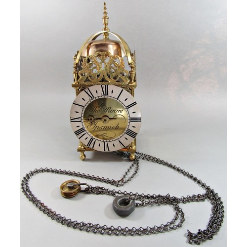 1453 - A traditional old English style lantern clock with brass case, silvered dial and timber wall bracket... 