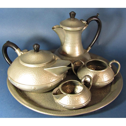 1200 - A four piece Craftsman Arts and Crafts style pewter hammered tea service with a similar Knighthood c... 