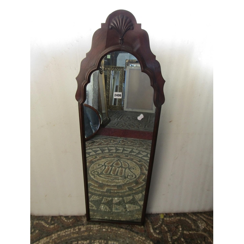 2406 - A Queen Anne style pier glass with stepped and moulded arched frame, 36 cm x 105 cm