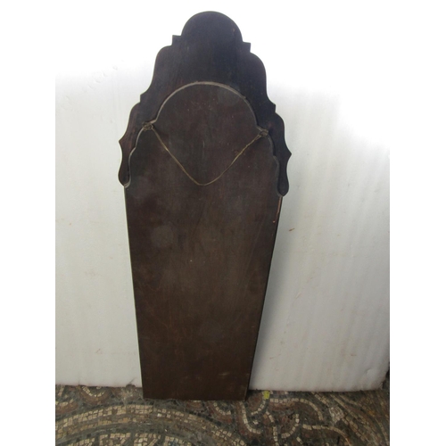 2406 - A Queen Anne style pier glass with stepped and moulded arched frame, 36 cm x 105 cm