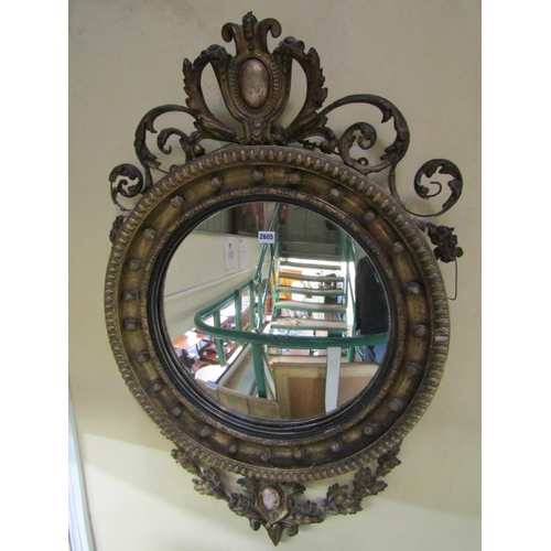 2605 - A good quality Regency mahogany convex wall mirror with original gilded finish, the mirror plate 48c... 