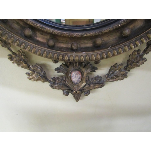 2605 - A good quality Regency mahogany convex wall mirror with original gilded finish, the mirror plate 48c... 