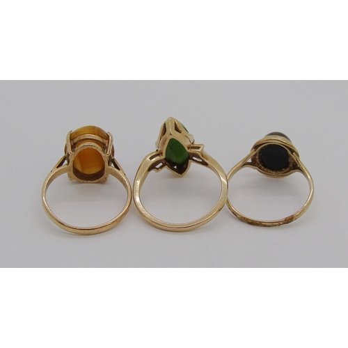 1346 - Three gold cabochon gem rings; a 10k nephrite example, a 9ct tigers eye example and a 9ct quartz exa... 