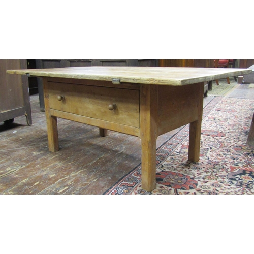 2645 - A scrubbed pine occasional table with plank top over a deep frieze drawer, raised on short chamfered... 