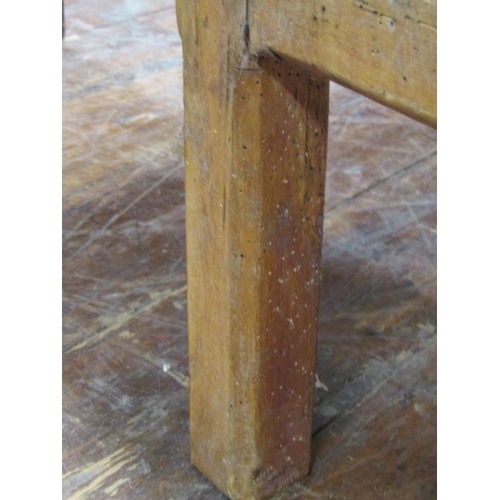 2645 - A scrubbed pine occasional table with plank top over a deep frieze drawer, raised on short chamfered... 