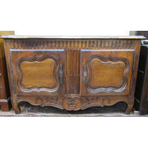 2646 - 18th century continental walnut buffet enclosed by two panelled doors with further carved detail on ... 