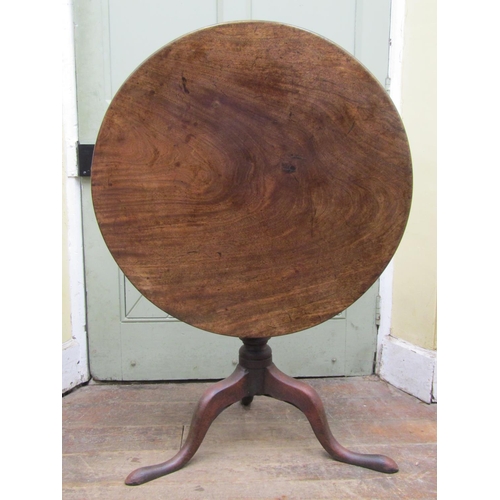 2605A - A Georgian mahogany snap top occasional table, the circular one piece top 81cm with bird cage action... 