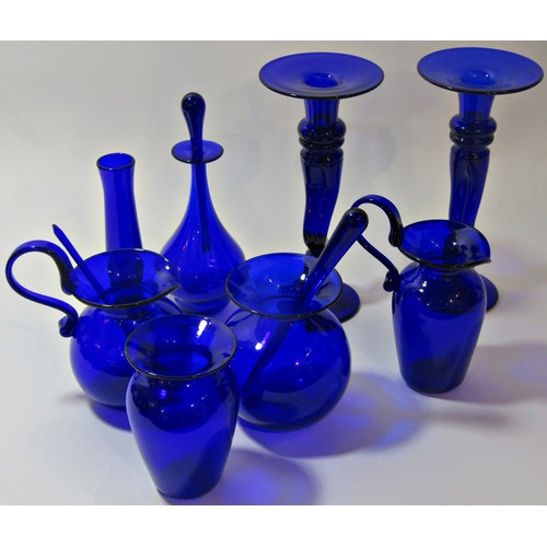 1187 - A collection of Bristol cobalt blue glass ornaments to include two candlesticks, two jugs and three ... 