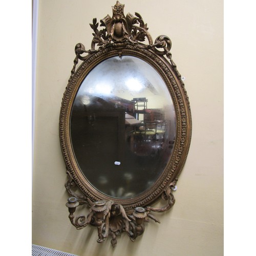 2691 - A 19th century girondelle ,the oval gilt gesso frame with scrolling and trailing foliate detail (lab... 