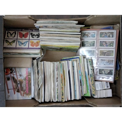 295A - A box containing a large collection of albums of Brooke Bond and PG Tips cards, Wills and John Playe... 