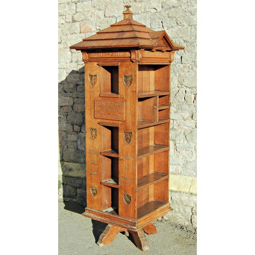 2581 - A Tabard Inn revolving library bookcase in oak designed by Seymour Easton, 1859-1916, raised on a re...