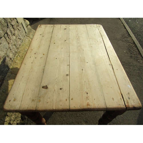 2558A - A late Victorian scrubbed pine kitchen table raised on turned supports (lacks frieze drawer, AF) 4ft... 