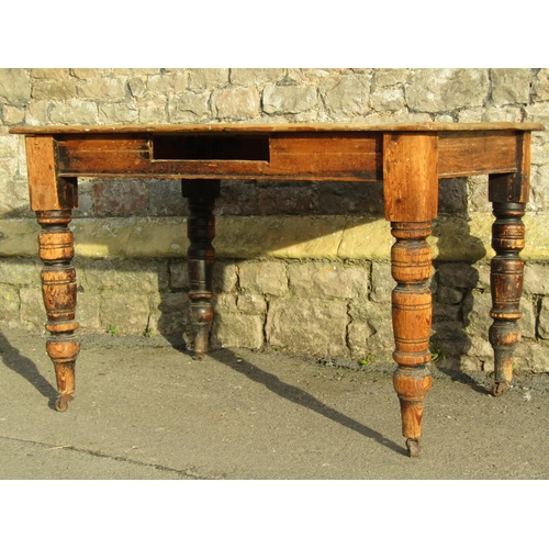 2558A - A late Victorian scrubbed pine kitchen table raised on turned supports (lacks frieze drawer, AF) 4ft... 