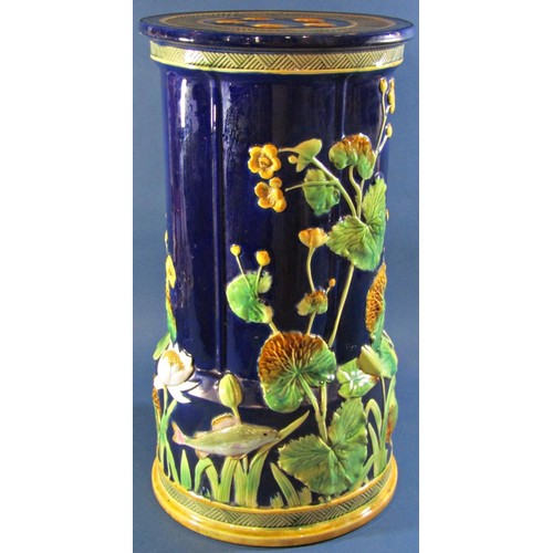 1070 - A George Jones majolica jardinière stand decorated with fish and aquatic plants on a dark blue backg...