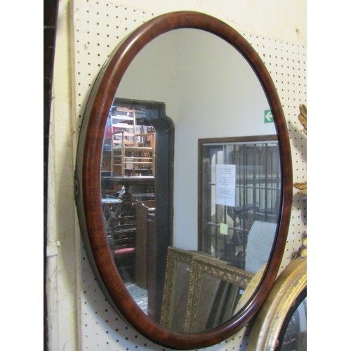 2406 - A Queen Anne style pier glass with stepped and moulded arched frame, 36 cm x 105 cm