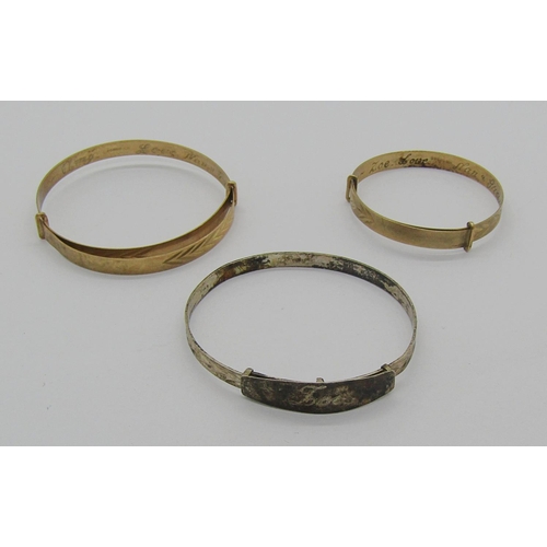 1264 - Three christening bangles with inscriptions; two 9ct examples, 6.4g total and a silver example (3)