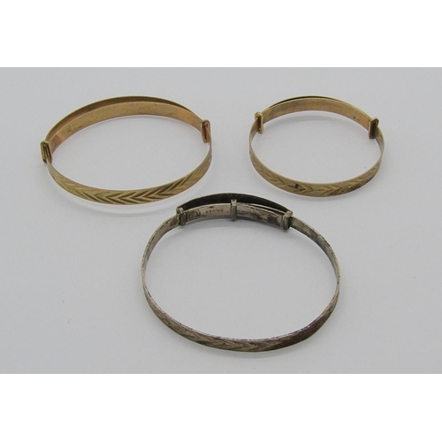 1264 - Three christening bangles with inscriptions; two 9ct examples, 6.4g total and a silver example (3)