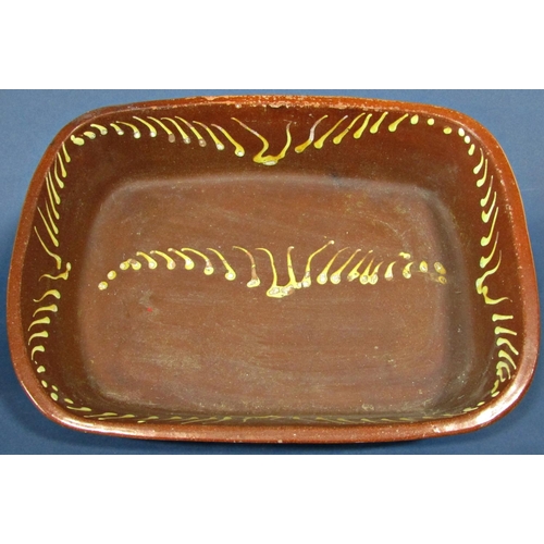 1038 - A large slipware baking dish with traditional combed finish, 48cm long x 36cm wide x 10cm high