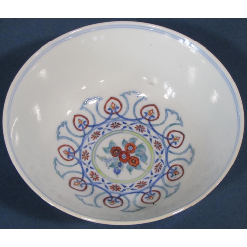 1055 - A Chinese Douai porcelain bowl with six character Daoguang mark beneath, with blue and white under g... 