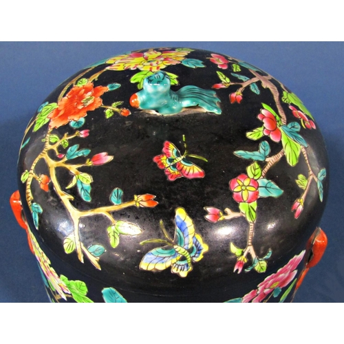 1058 - A Chinese famille verte bowl and cover with peony and prunus blossom detail, 22cm high