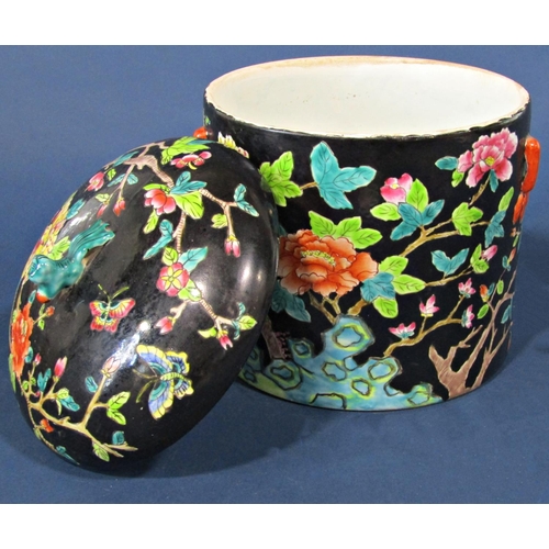 1058 - A Chinese famille verte bowl and cover with peony and prunus blossom detail, 22cm high