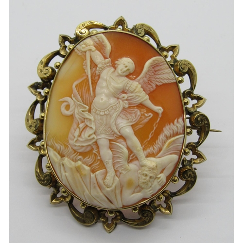 1299 - Good quality antique cameo brooch depicting St Michael slaying the Devil, in ornate yellow metal fra... 