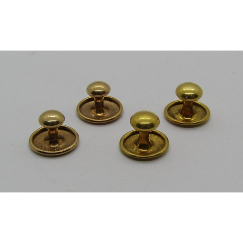 1320 - Two pairs of gold dress studs; two 18ct examples, 1.5g and two 9ct examples, 1g, contained in an ass... 