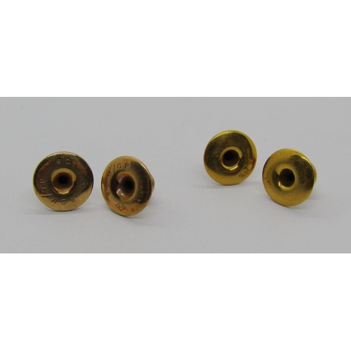 1320 - Two pairs of gold dress studs; two 18ct examples, 1.5g and two 9ct examples, 1g, contained in an ass... 