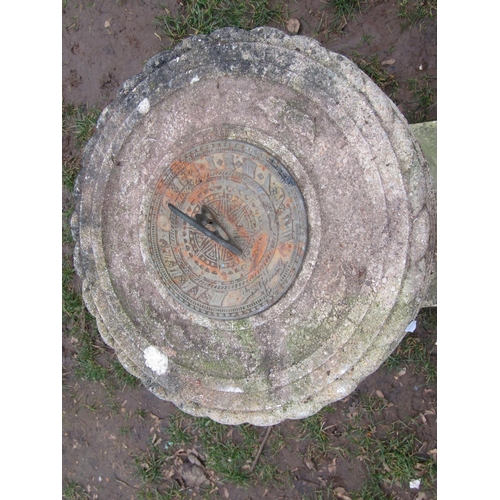 2014 - A garden sundial, the circular dial with pierced gnomon set on a two sectional composition stone bas... 