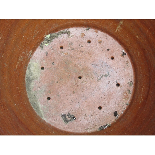 2020 - A glazed terracotta pan/crock of circular tapered form (later adapted as a planter with drilled base... 