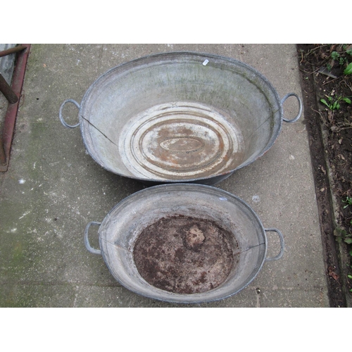 2021 - A vintage oval galvanised tin two handled bath 65 cm long (excluding handles) x 48 cm wide x 24 cm h... 