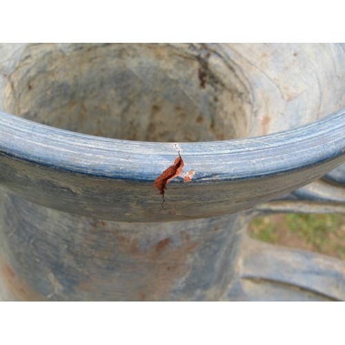 2042 - A large contemporary painted and incised terracotta pitcher with fan tailed fish, scrolled handle an... 