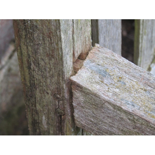 2043 - A vintage weathered teak two seat garden bench with slatted seat and back (af), 120 cm wide