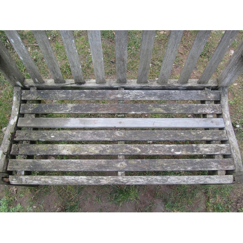 2048 - A vintage weathered teak two seat garden bench with slatted seat and back, 125 cm wide (af)