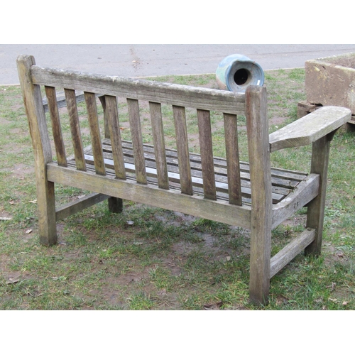 2048 - A vintage weathered teak two seat garden bench with slatted seat and back, 125 cm wide (af)