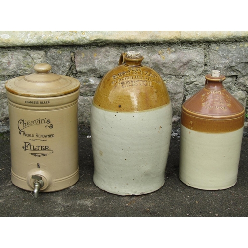 2057 - Two vintage stoneware flagons, one and two gallon capacity both with impressed merchants marks for B... 