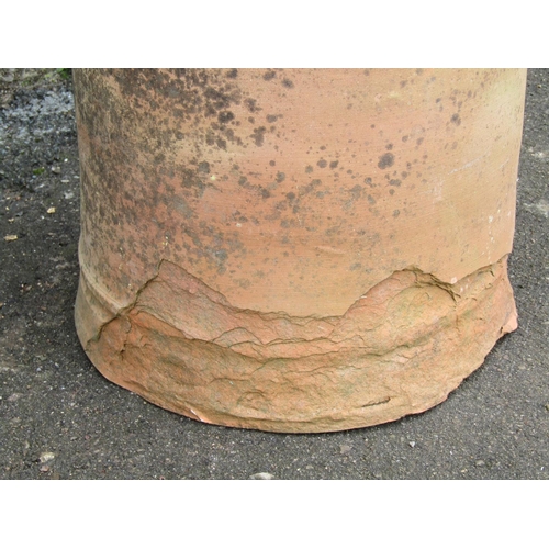 2058 - A weathered terracotta bell shaped rhubarb forcer and domed cap, 65 cm high (af)